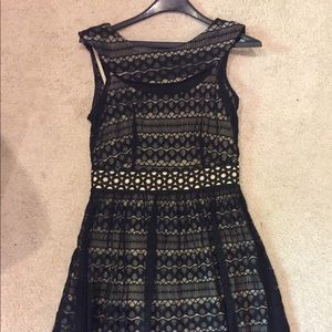 Sleeveless black lace dress